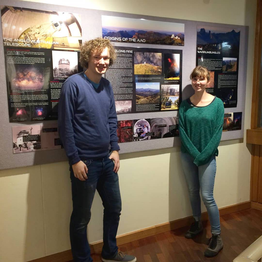 Myself and Caro Derkenne in front of the history photo wall.